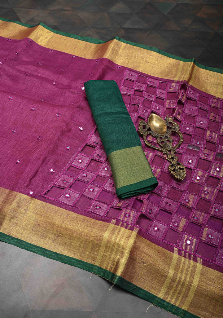 Magenta Cutwork and Mirror Work Tissue Linen Saree with dramatic tassels