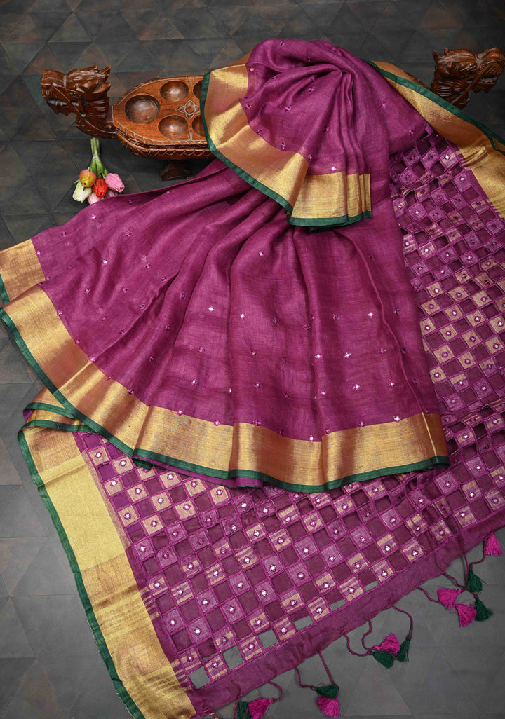 Magenta Cutwork and Mirror Work Tissue Linen Saree with dramatic tassels