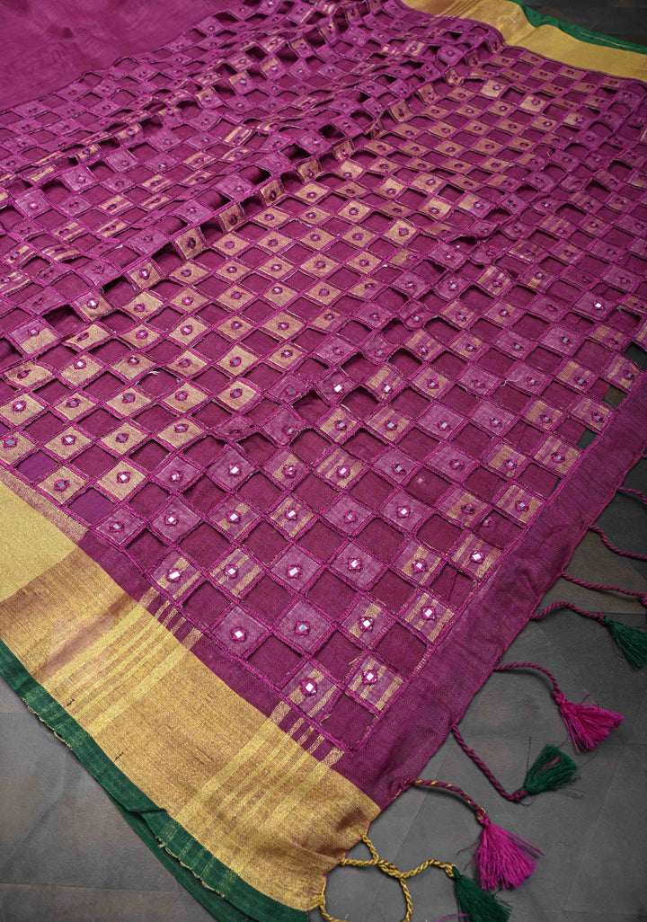 Magenta Cutwork and Mirror Work Tissue Linen Saree with dramatic tassels