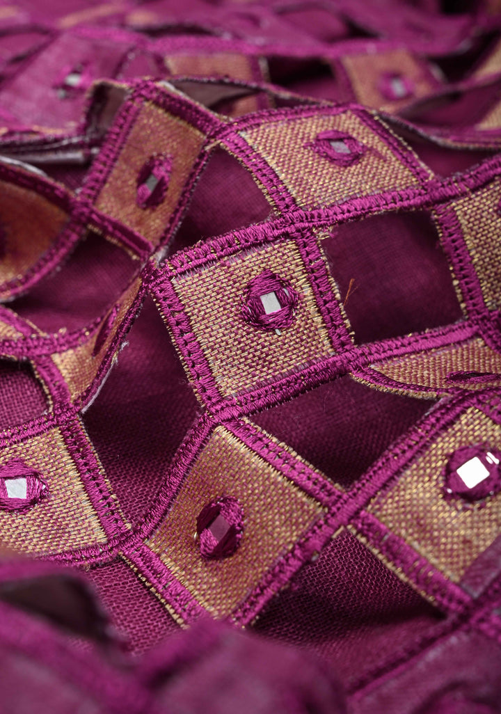 Magenta Cutwork and Mirror Work Tissue Linen Saree with dramatic tassels