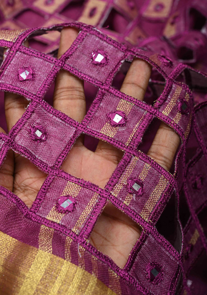 Magenta Cutwork and Mirror Work Tissue Linen Saree with dramatic tassels