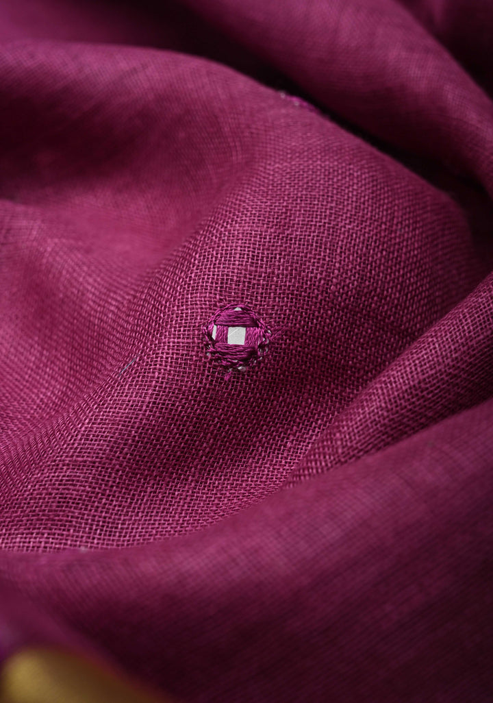 Magenta Cutwork and Mirror Work Tissue Linen Saree with dramatic tassels