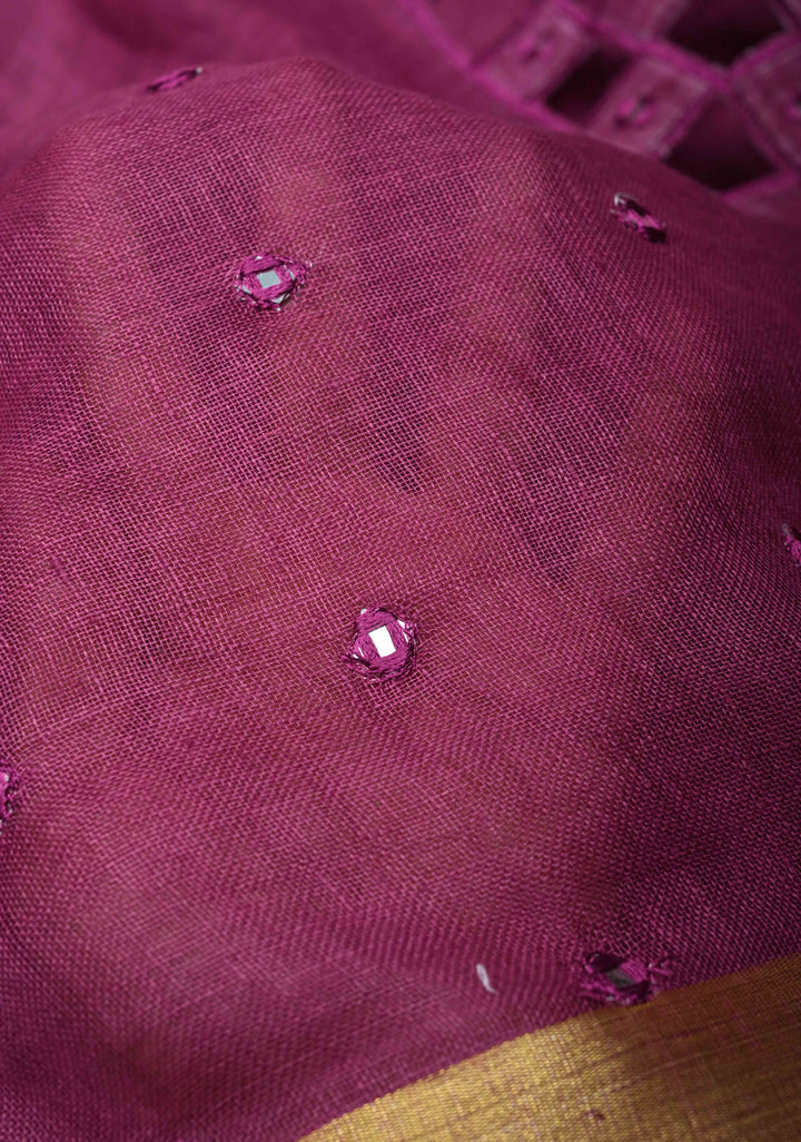 Magenta Cutwork and Mirror Work Tissue Linen Saree with dramatic tassels