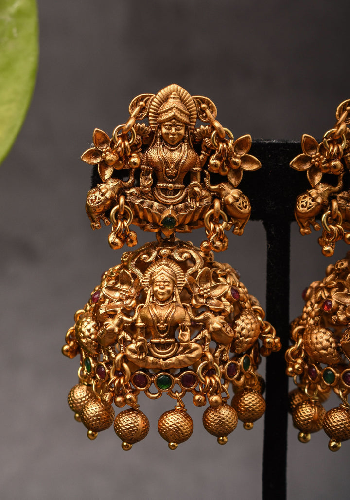 Antique Dark Gold Tone Lakshmi Design Prominent Jhumka earrings | Shobitam Jewelry