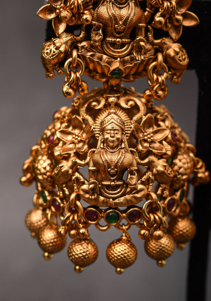 Antique Dark Gold Tone Lakshmi Design Prominent Jhumka earrings | Shobitam Jewelry