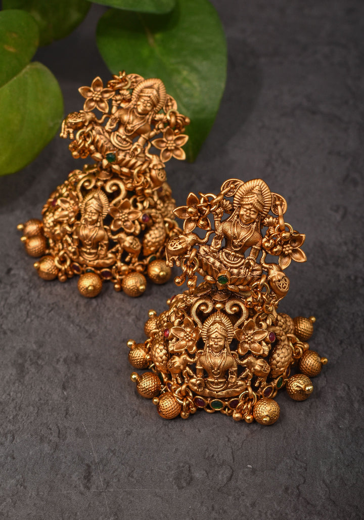 Antique Dark Gold Tone Lakshmi Design Prominent Jhumka earrings | Shobitam Jewelry