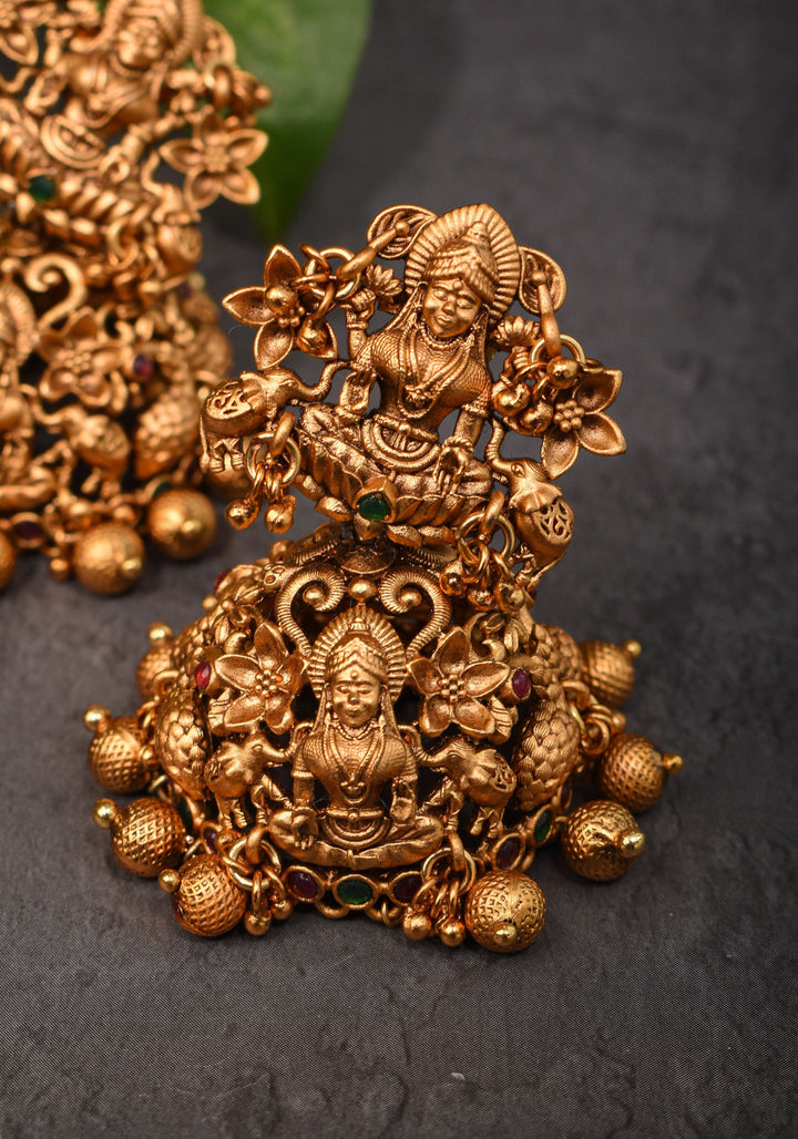 Antique Dark Gold Tone Lakshmi Design Prominent Jhumka earrings | Shobitam Jewelry