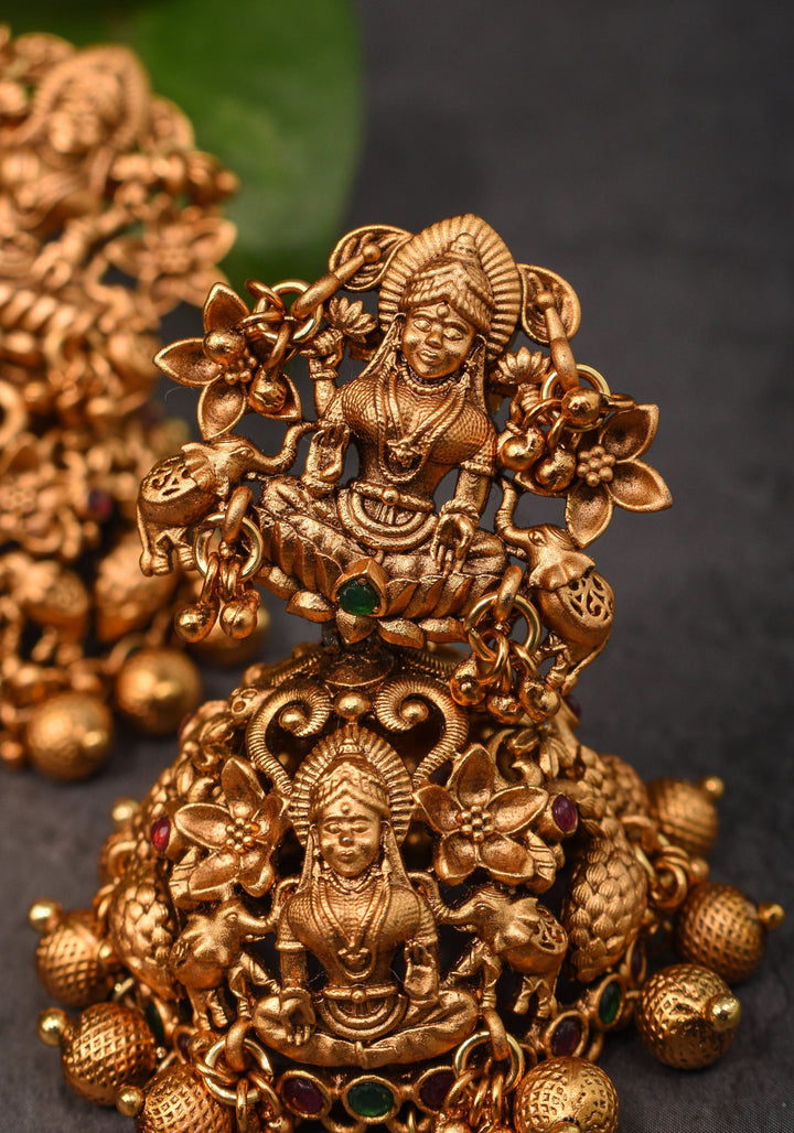 Antique Dark Gold Tone Lakshmi Design Prominent Jhumka earrings | Shobitam Jewelry