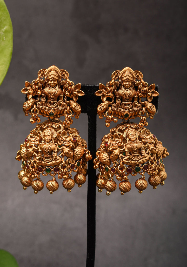 Antique Dark Gold Tone Lakshmi Design Prominent Jhumka earrings | Shobitam Jewelry