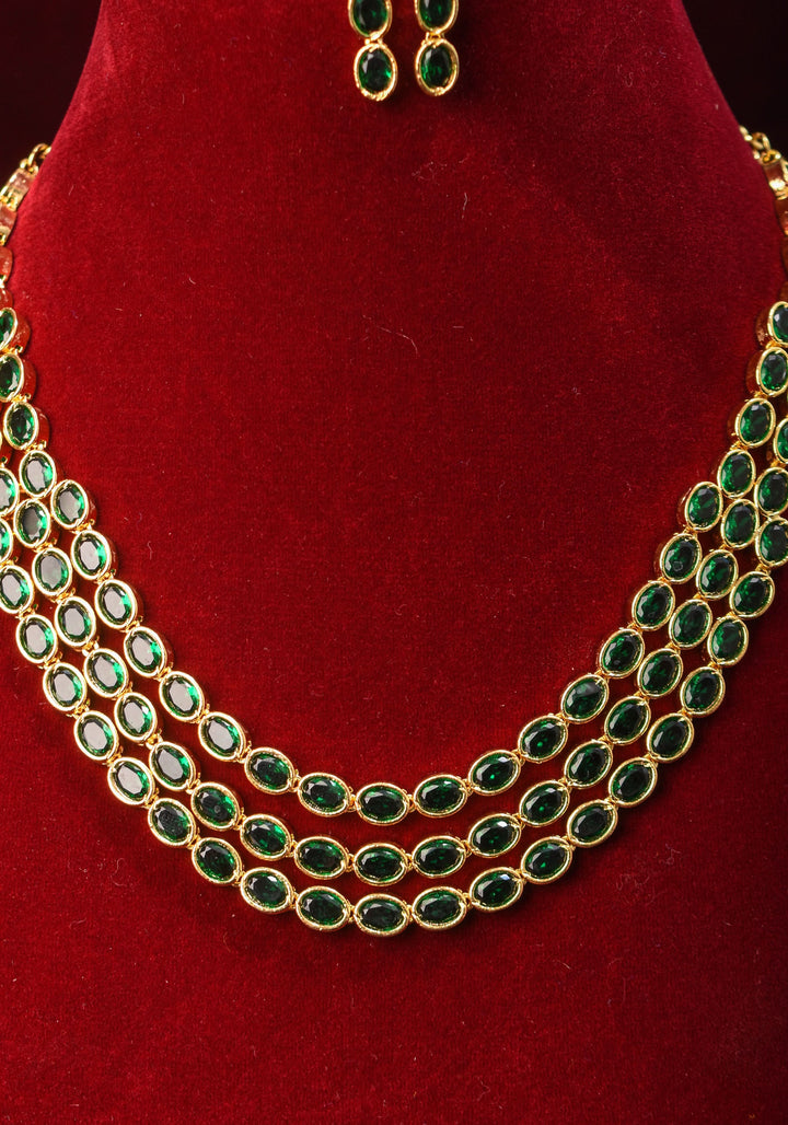 Green Stone Necklace with 3 strands of oval stones and matching earrings