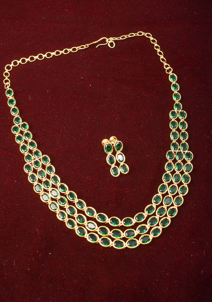 Green Stone Necklace with 3 strands of oval stones and matching earrings