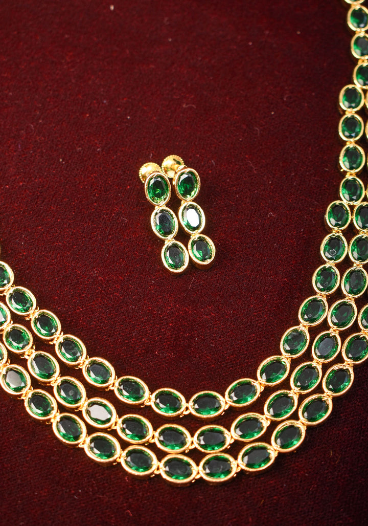 Green Stone Necklace with 3 strands of oval stones and matching earrings