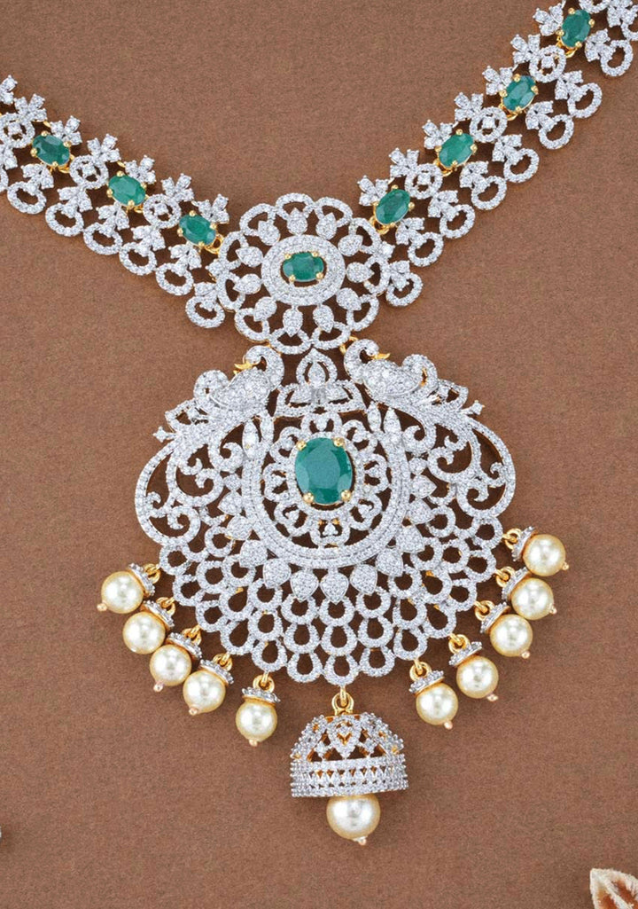 92.5  Silver Zirconia Stone Floral Necklace and Earrings Set with Twin Peacock Motifs ( Maang Tika not included)