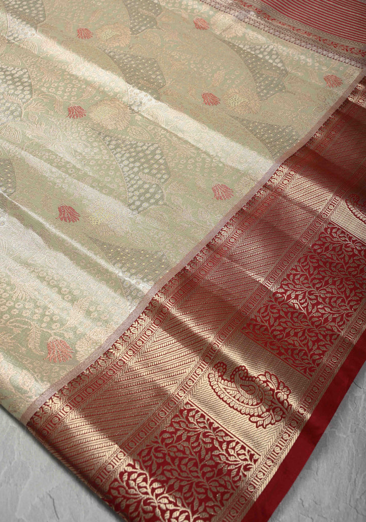 Light Green Brocade on Kanjivaram Tissue Semi Silk Saree with Meenakari Buttas and Contrast Zari Border