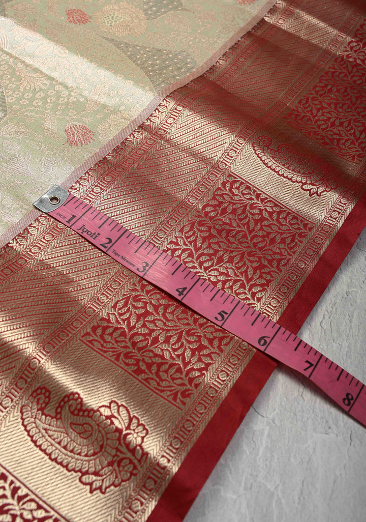 Light Green Brocade on Kanjivaram Tissue Semi Silk Saree with Meenakari Buttas and Contrast Zari Border