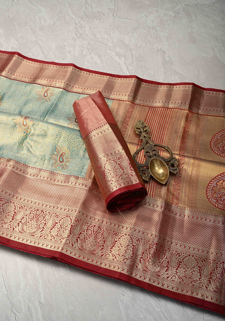 Teal Brocade Jaal on Kanjivaram Tissue Semi Silk Saree with Meenakari Buttas and Contrast Zari Border