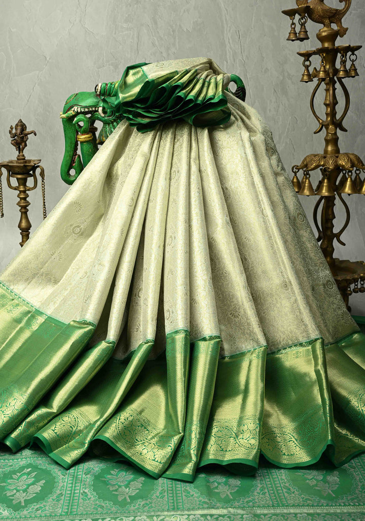 Sage Green Kanjivaram Tissue Semi Silk Saree with Floral Brocade Jaal and Contrast Wide Zari Border