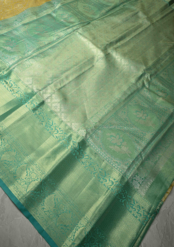 Exquisite Yellow Kanjivaram Tissue Semi Silk Saree with Floral Brocade Jaal and Contrast Wide Zari Border