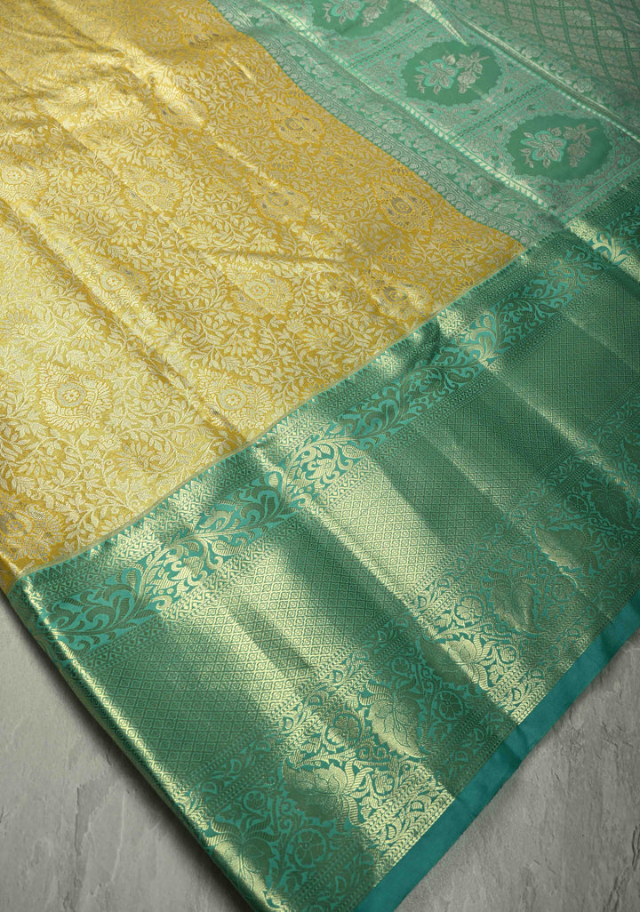 Exquisite Yellow Kanjivaram Tissue Semi Silk Saree with Floral Brocade Jaal and Contrast Wide Zari Border