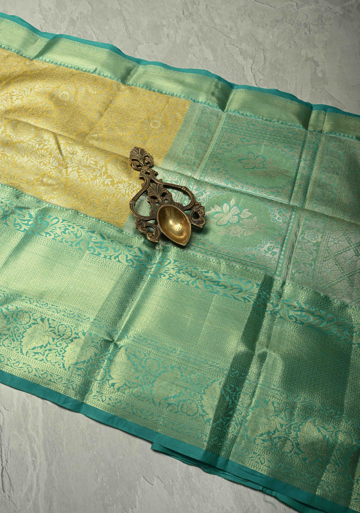 Exquisite Yellow Kanjivaram Tissue Semi Silk Saree with Floral Brocade Jaal and Contrast Wide Zari Border