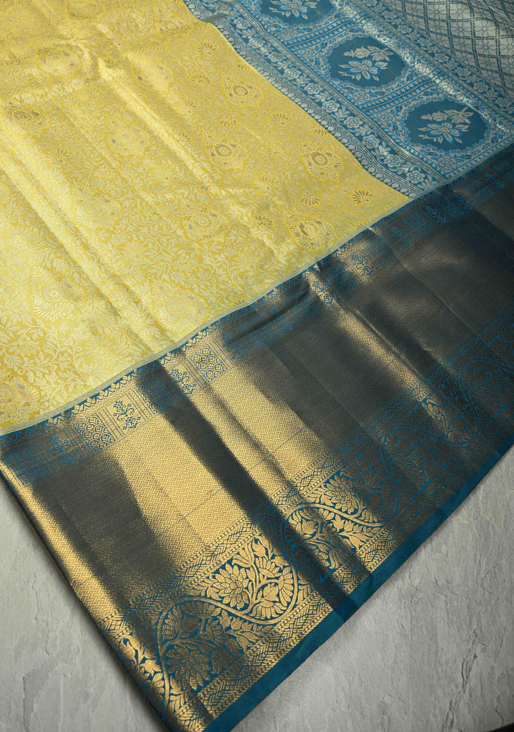 Butter Yellow Kanjivaram Tissue Semi Silk Saree with Meenakari Floral Brocade Jaal and Blue Zari Border