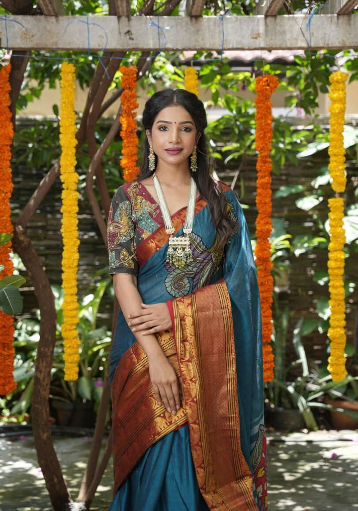 Peacock blue Narayanpet saree with pen kalamkari appliqué and wide zari borders