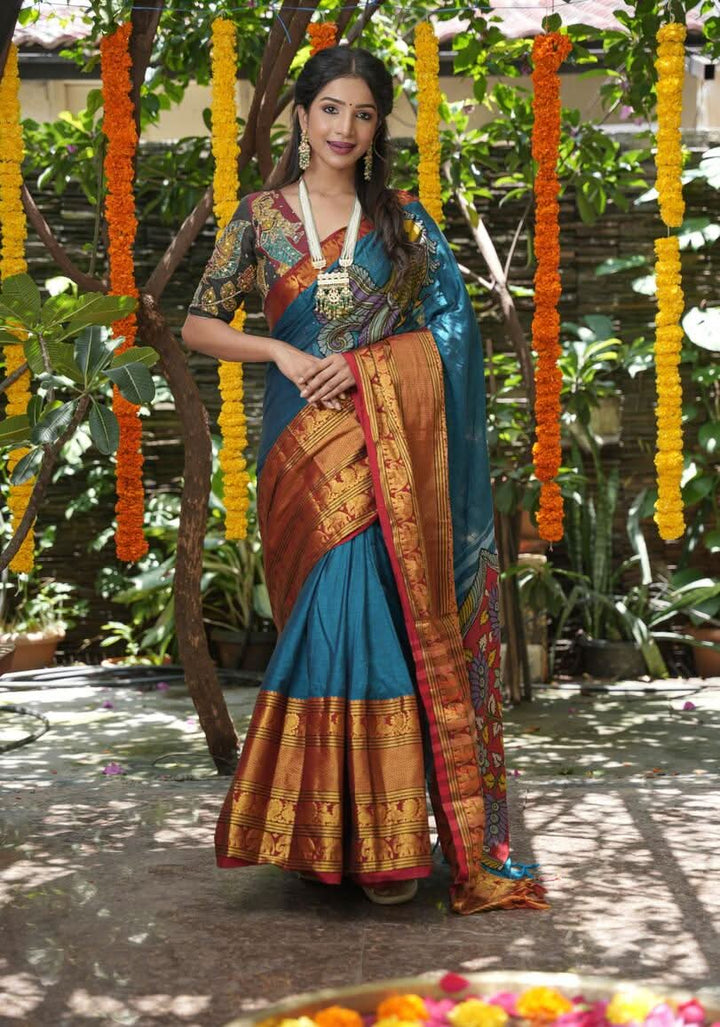 Peacock blue Narayanpet saree with pen kalamkari appliqué and wide zari borders