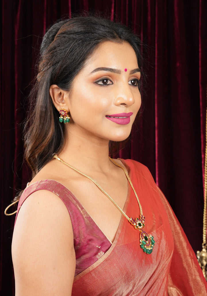 Deep Square Neck Sleeveless blouse in Reddish pink Pure Tissue Raw silk with zari buttas