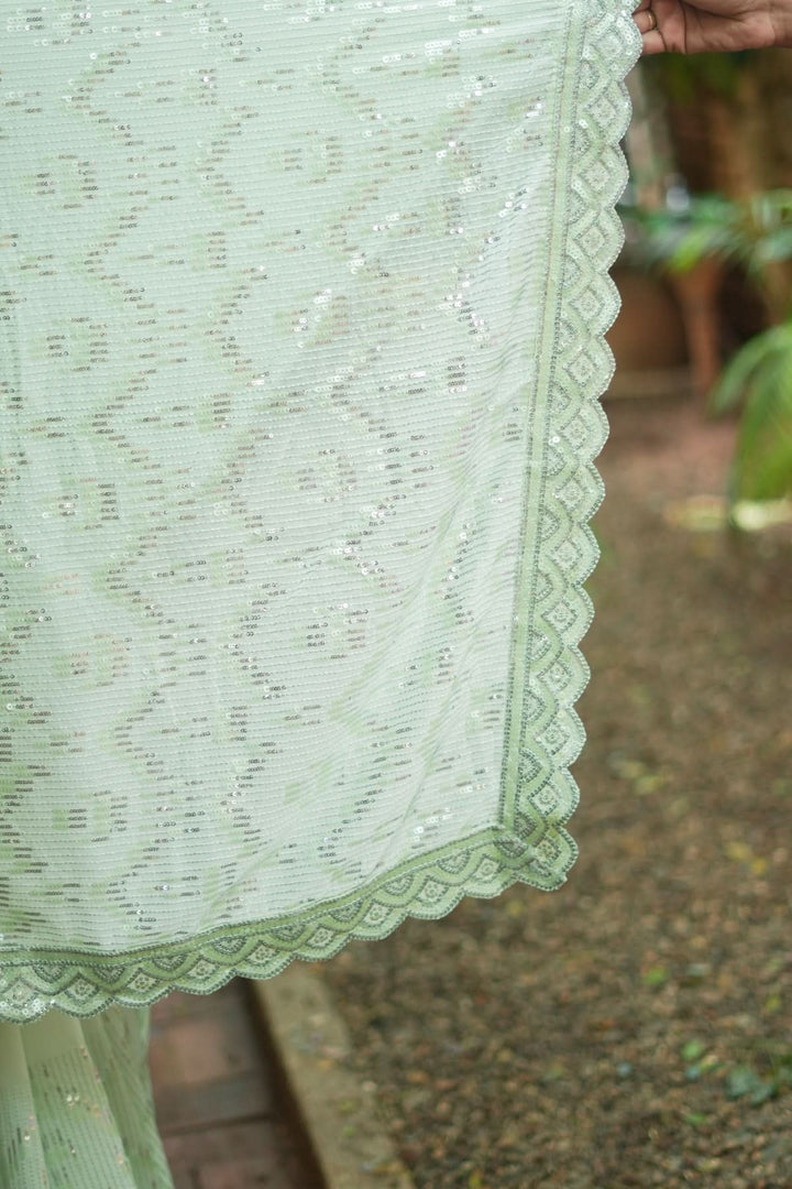 Full Sequins Embellished Georgette Saree in Sage Green with Scalloped border
