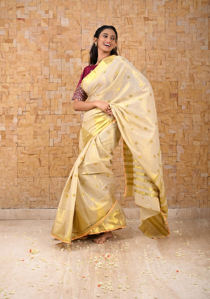 Beige Tissue Cotton Saree with Zari Coin Buttis And Temple Border