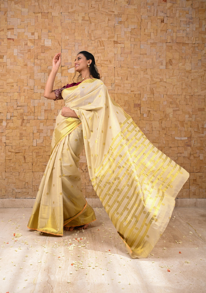 Beige Tissue Cotton Saree with Zari Coin Buttis And Temple Border