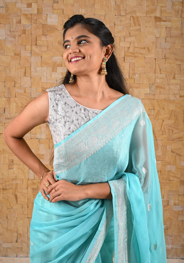 Ahmedabadi Jadau Jhumkas With Gold Green And Pearl Embellishments