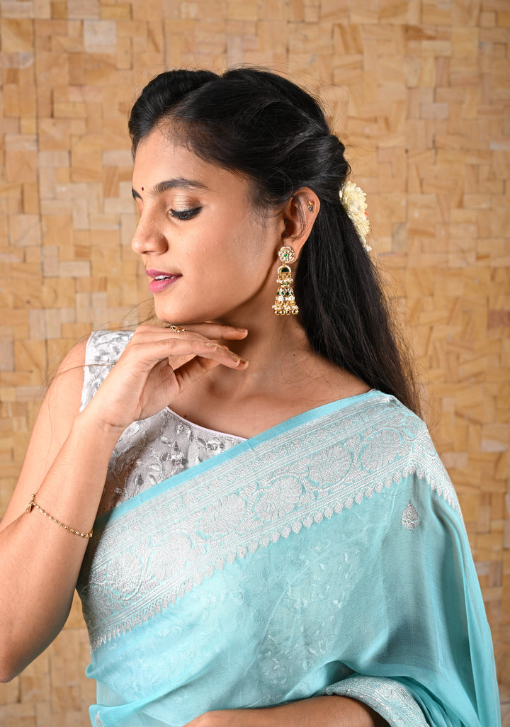 Ahmedabadi Jadau Jhumkas With Gold Green And Pearl Embellishments