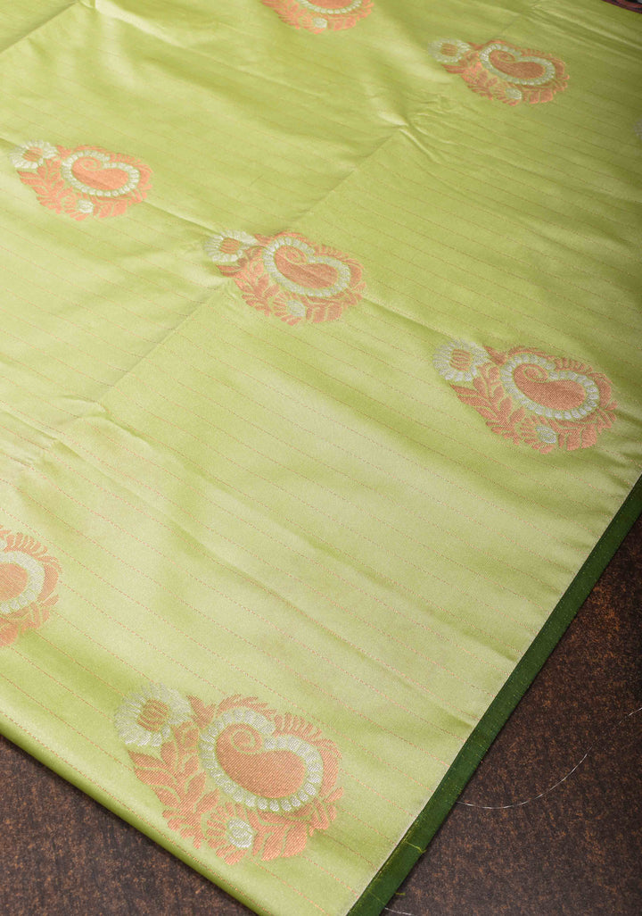 Tea Green Borderless Semi Silk Saree with Zari Stripes and Alfi Paisley Motifs