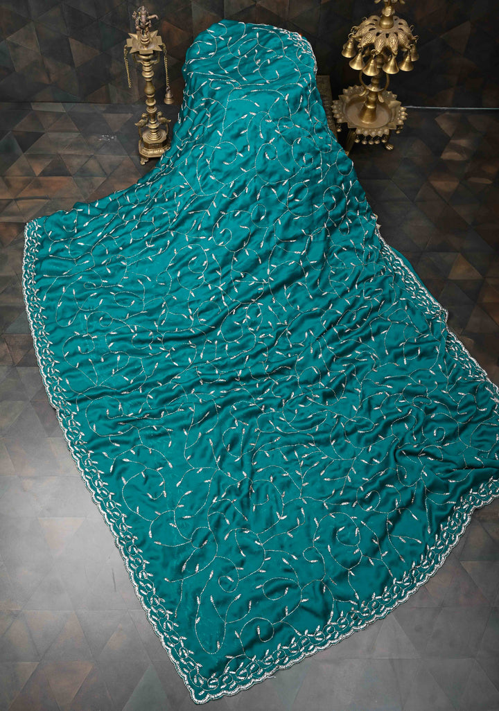 Teal Blue Full Jaal Cutdana embellished saree in Satin Georgette