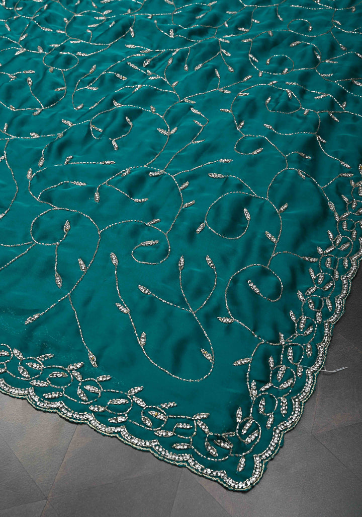 Teal Blue Full Jaal Cutdana embellished saree in Satin Georgette