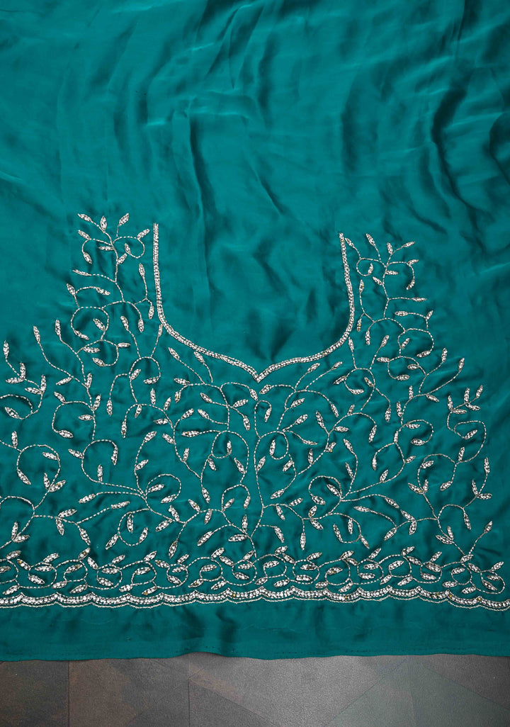Teal Blue Full Jaal Cutdana embellished saree in Satin Georgette