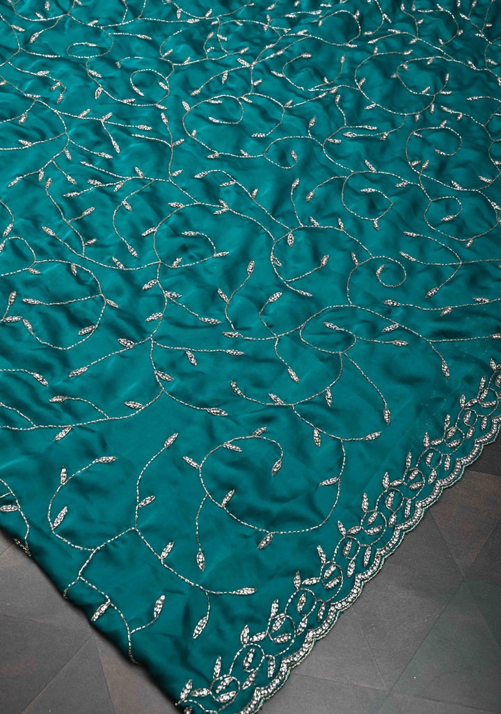 Teal Blue Full Jaal Cutdana embellished saree in Satin Georgette