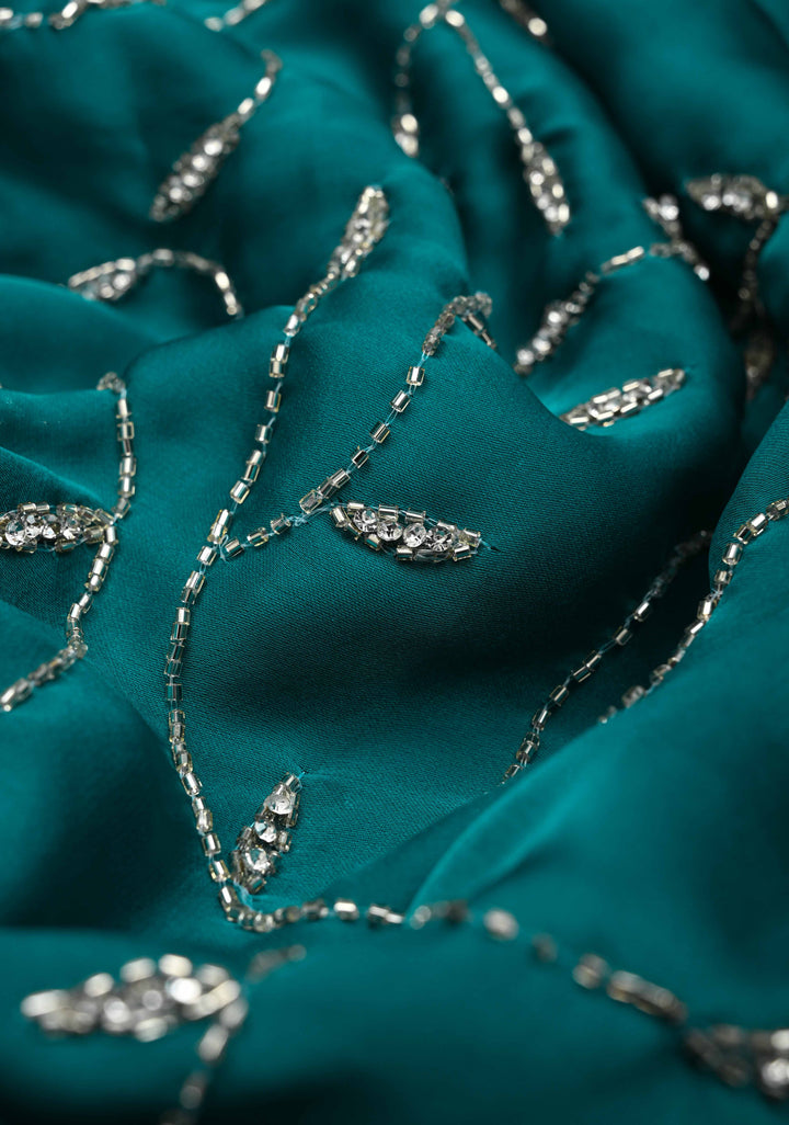 Teal Blue Full Jaal Cutdana embellished saree in Satin Georgette
