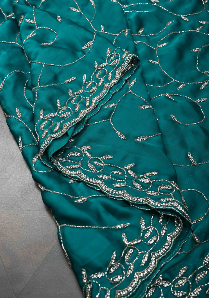Teal Blue Full Jaal Cutdana embellished saree in Satin Georgette