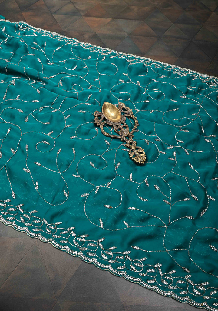 Teal Blue Full Jaal Cutdana embellished saree in Satin Georgette
