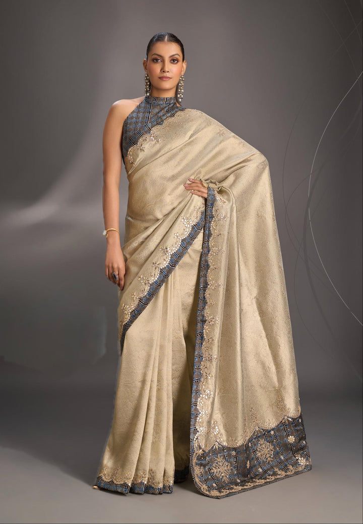 Beige Vegan Viscose Tissue Brocade Saree with Ajrakh Applique and Gota Patti work on Scallop Border