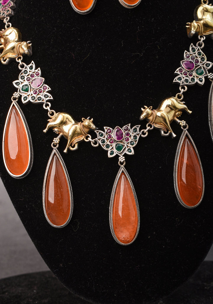 Fusion Dual Tone Jewelry with Pichwai Cow Units and burnt orange Stones | Shobitam Jewelry
