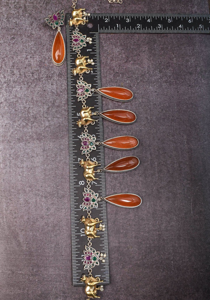 Fusion Dual Tone Jewelry with Pichwai Cow Units and burnt orange Stones | Shobitam Jewelry
