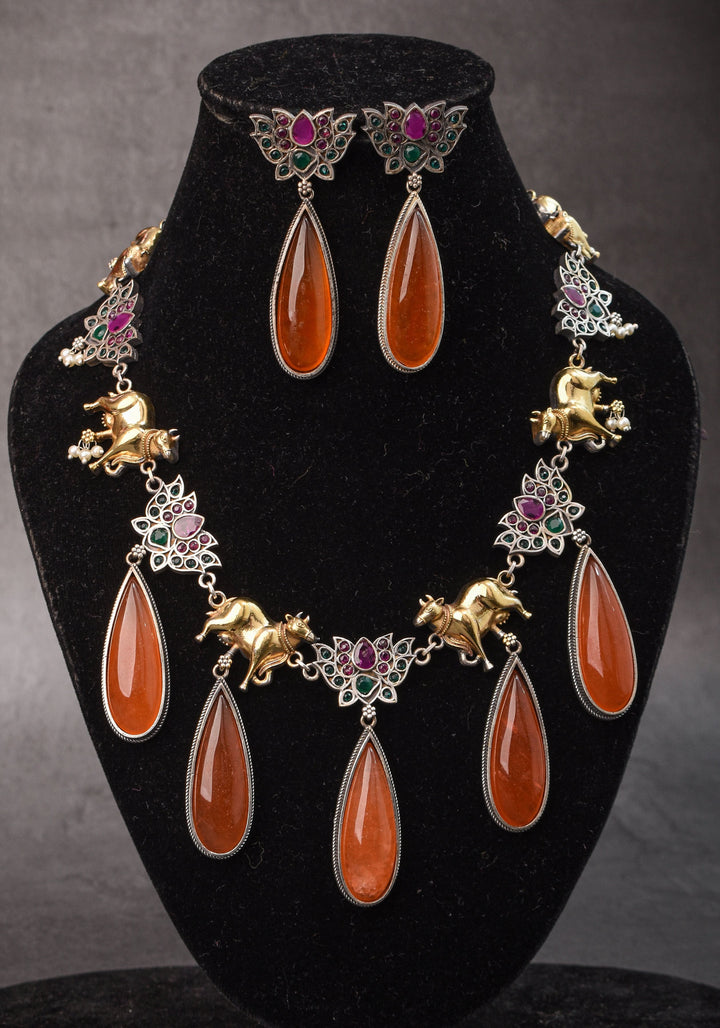 Fusion Dual Tone Jewelry with Pichwai Cow Units and burnt orange Stones | Shobitam Jewelry