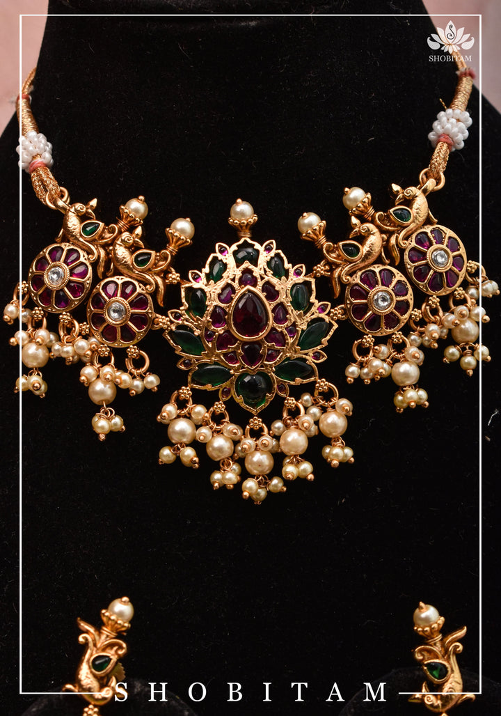 Jadau Lotus Stone Embellishment with Peacock units Choker Set In Green,Pink and white With Matching Earrings