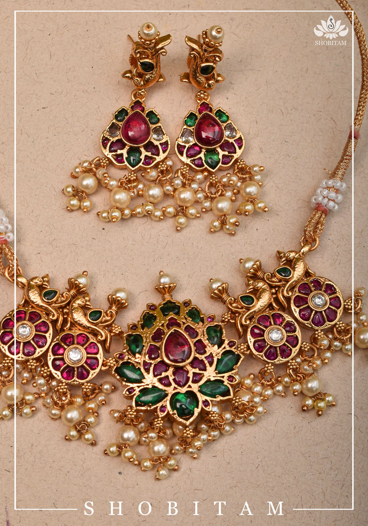 Jadau Lotus Stone Embellishment with Peacock units Choker Set In Green,Pink and white With Matching Earrings