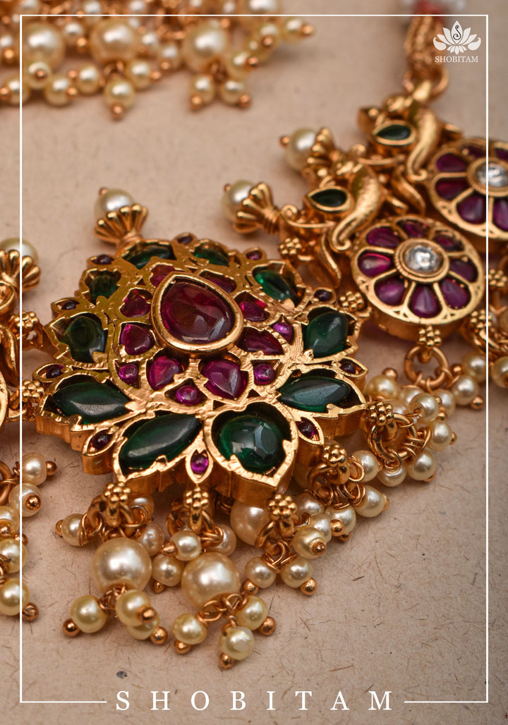 Jadau Lotus Stone Embellishment with Peacock units Choker Set In Green,Pink and white With Matching Earrings