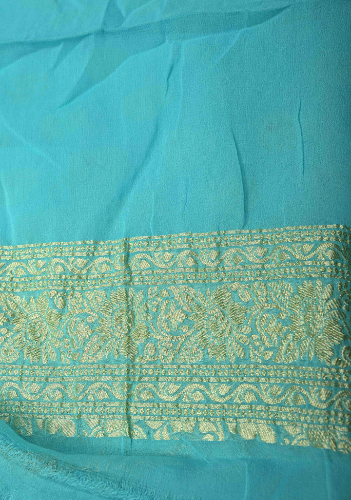 Authentic Turquoise Meenakari Work on Banarasi Silk Georgette Saree with Floral Buttas and 2 Side Equal Ornate Skirt Border | SILK MARK CERTIFIED