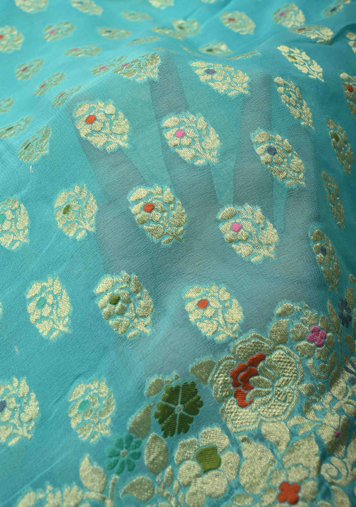 Authentic Turquoise Meenakari Work on Banarasi Silk Georgette Saree with Floral Buttas and 2 Side Equal Ornate Skirt Border | SILK MARK CERTIFIED